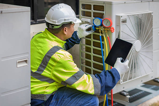 Professional Air Duct Cleaning technician working in Huntington, NY